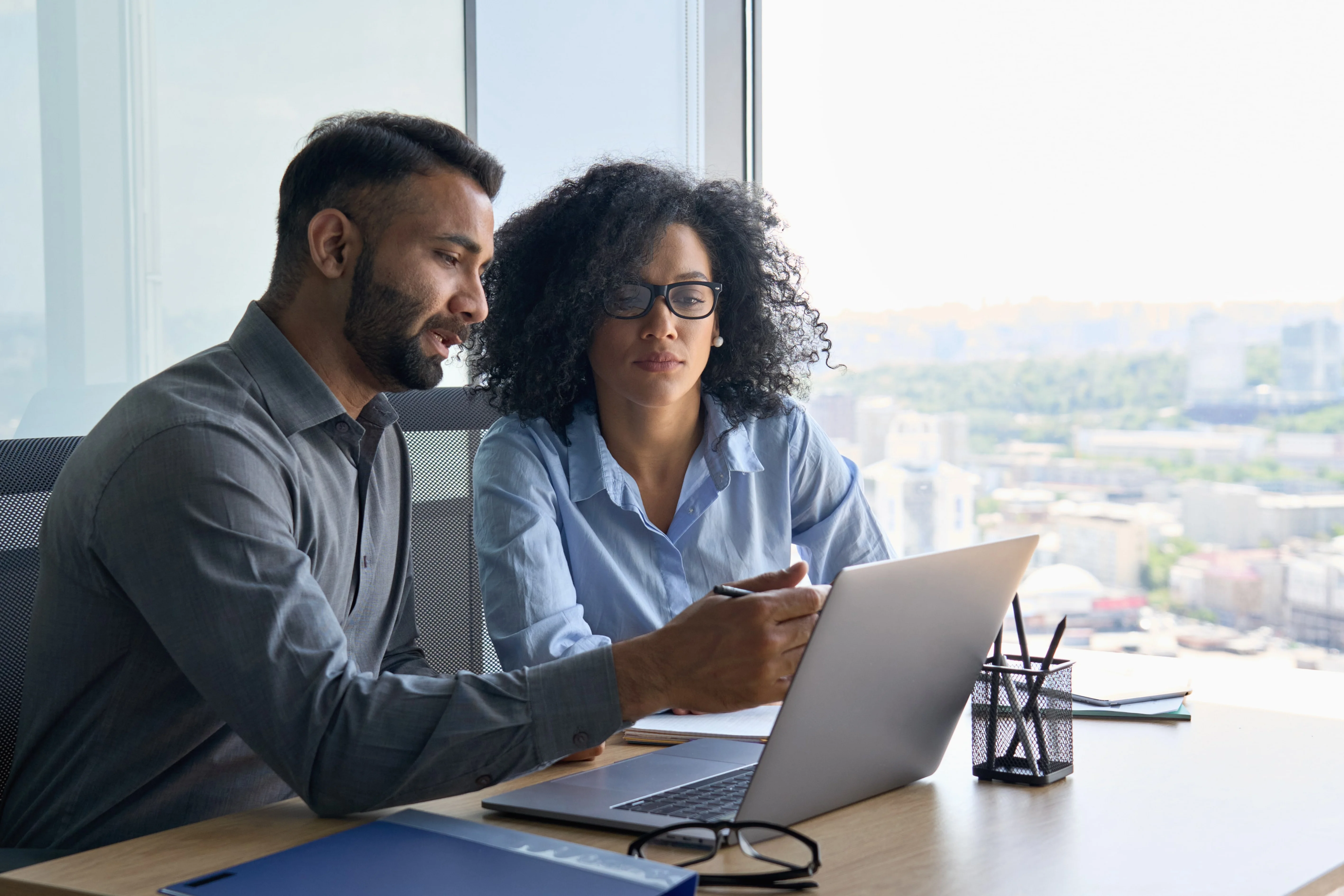 Business analyst explaining to a colleague